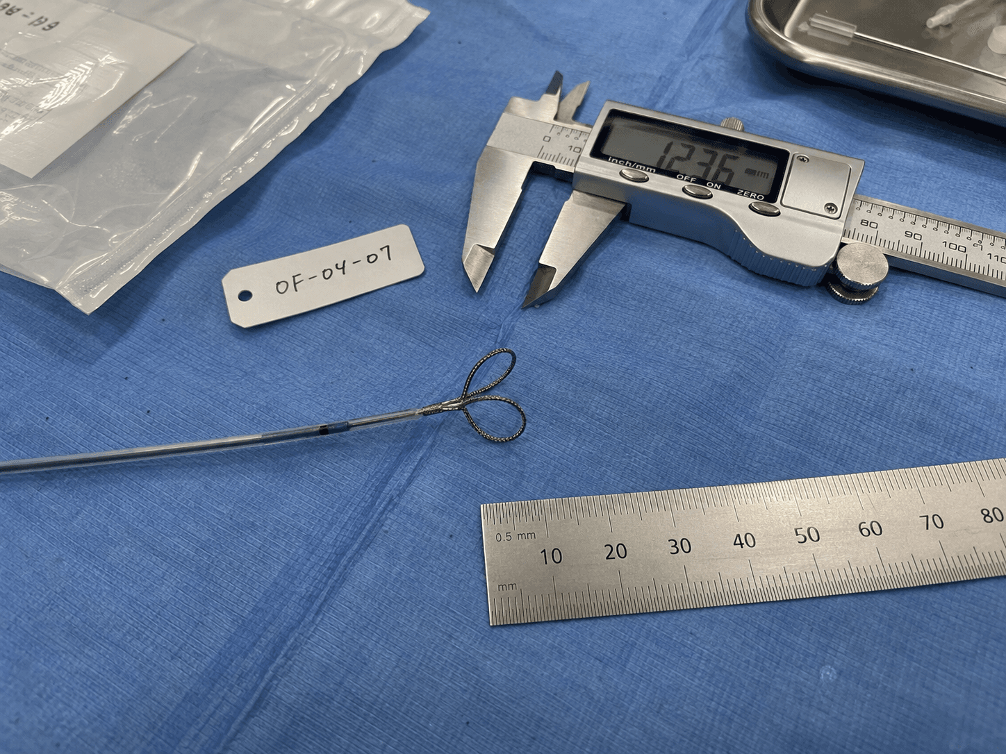 Fictional prototype photograph with a fixation frame and the visible specimen tag OF-04-07